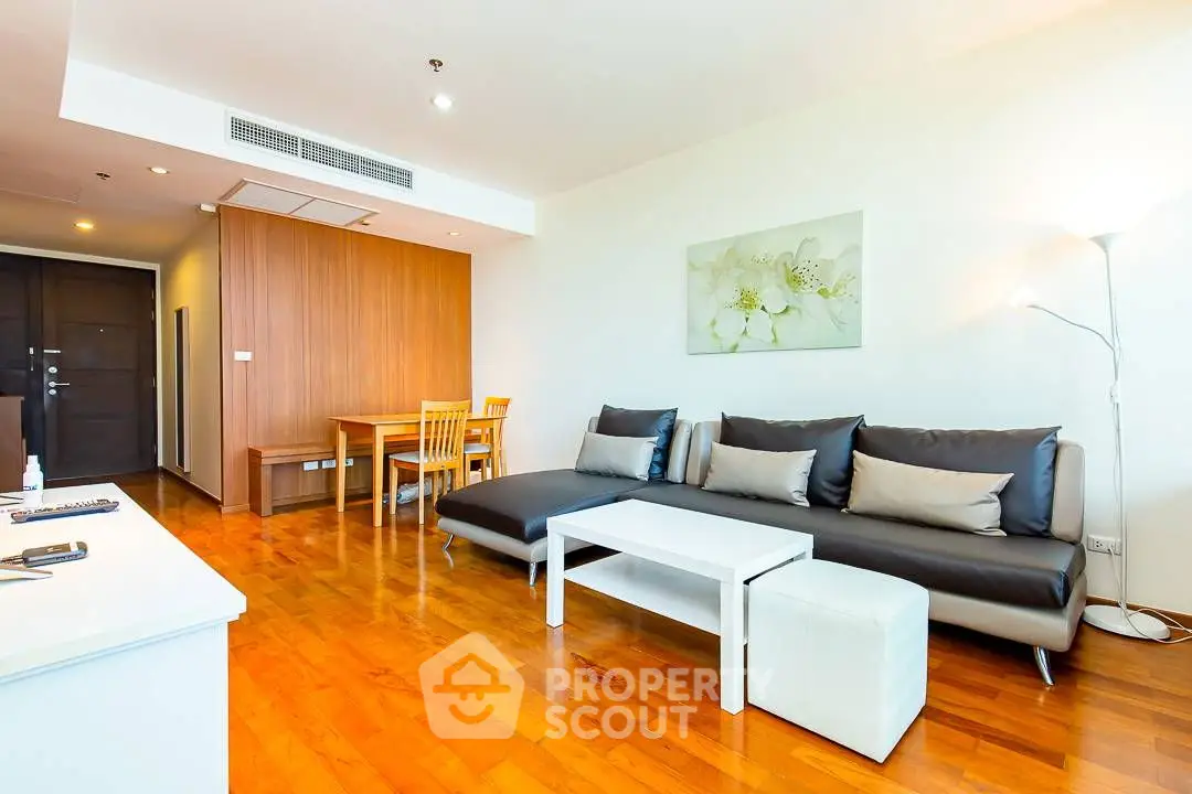 Modern living room with stylish decor and comfortable seating in a contemporary apartment.