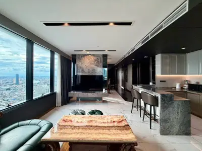 Luxurious high-rise living room with stunning city view and modern kitchen