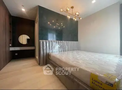 Luxurious bedroom with modern lighting and latex mattress in stylish apartment