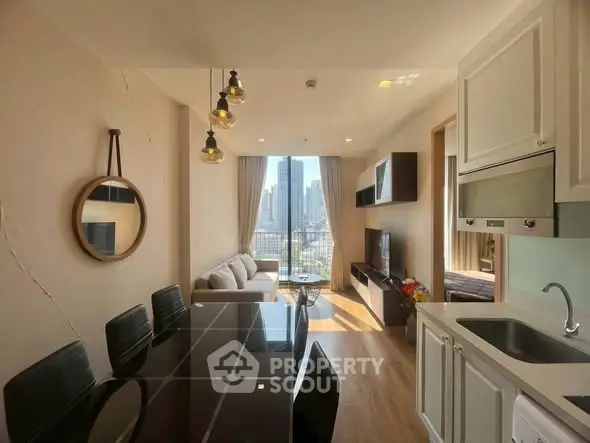 Modern living room with city view, stylish decor, and open kitchen layout in a high-rise apartment.