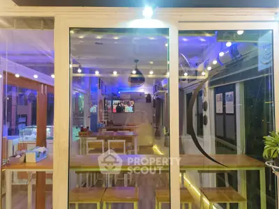 Modern dining area with wooden tables and ambient lighting