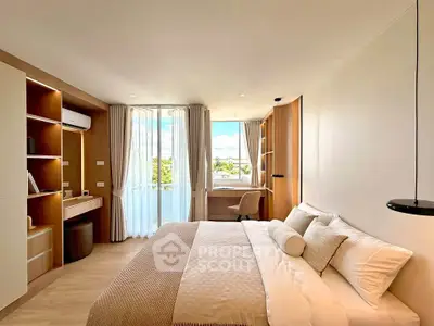 Spacious modern bedroom with large window and elegant decor