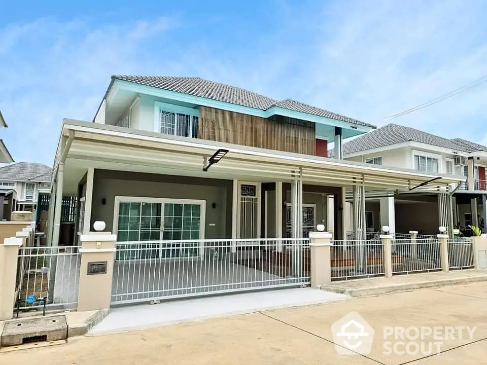 Modern two-story house with spacious driveway and contemporary design