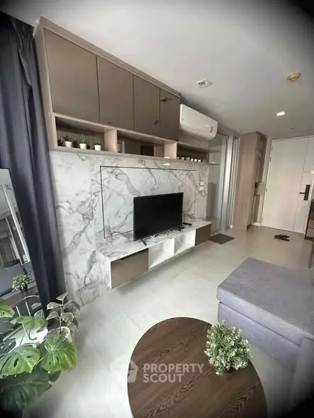 Modern living room with marble TV wall and stylish decor