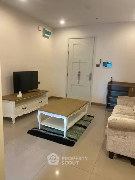 Cozy living room with elegant furniture and modern decor in a stylish apartment.