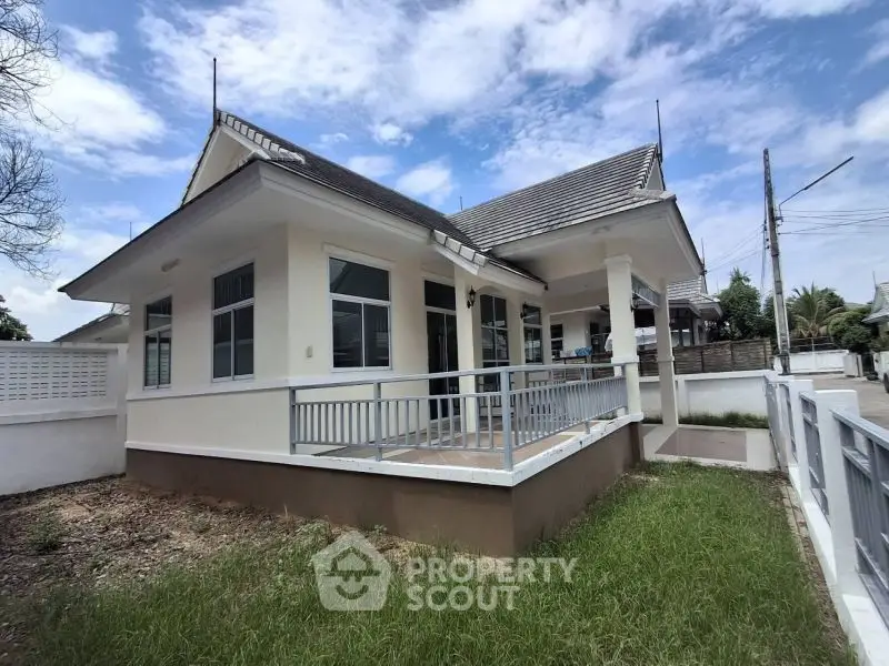 Charming single-story house with spacious front yard and modern design in a serene neighborhood.