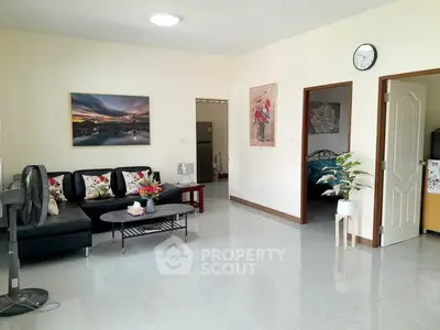 Spacious living room with modern decor and elegant furnishings