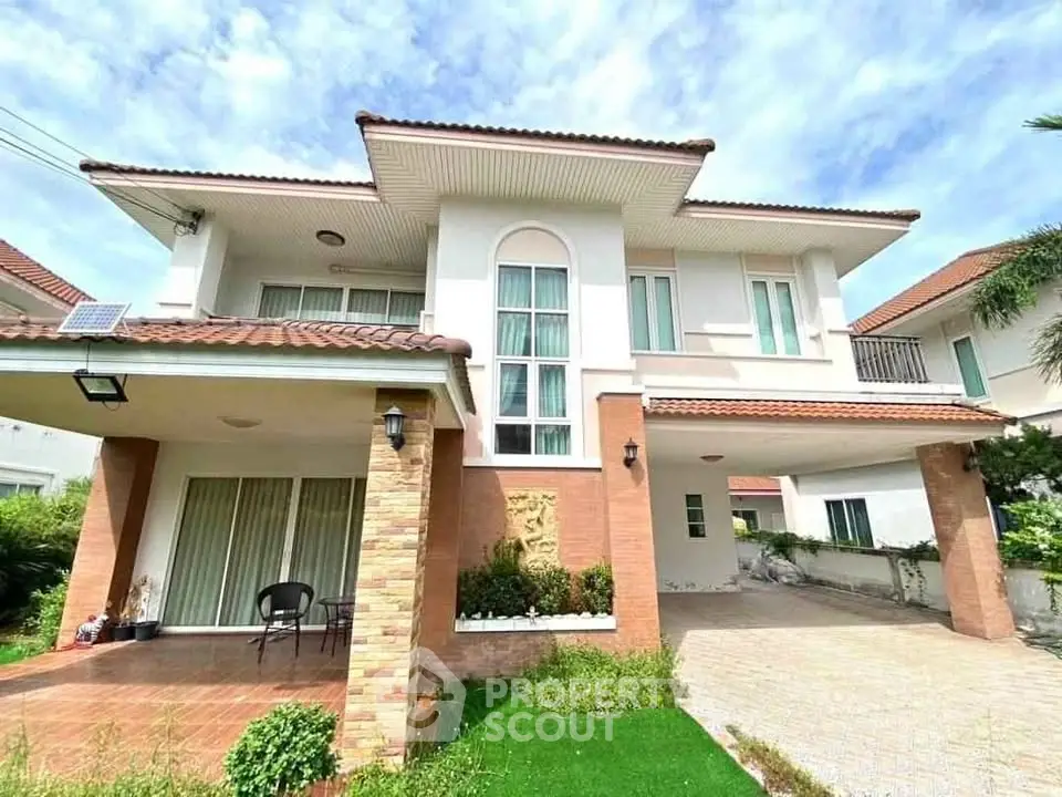 Stunning two-story house with modern design and spacious driveway in a serene neighborhood.