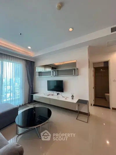 Modern living room with sleek furniture and city view