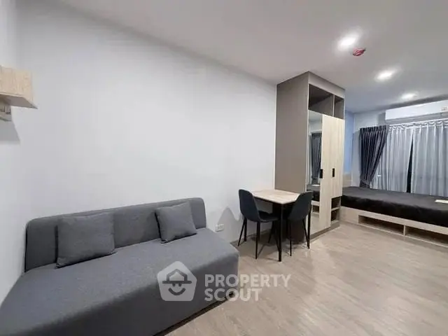 Modern studio apartment with sleek furniture and open layout
