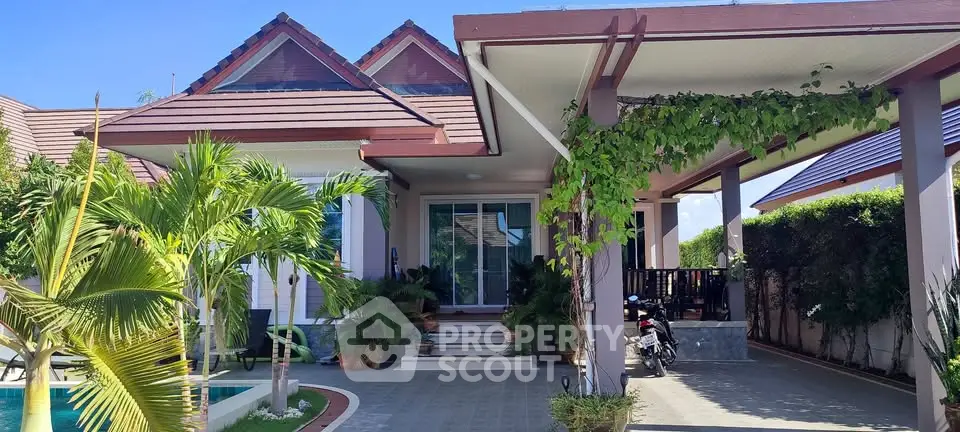 Charming tropical villa with lush garden and inviting poolside ambiance.