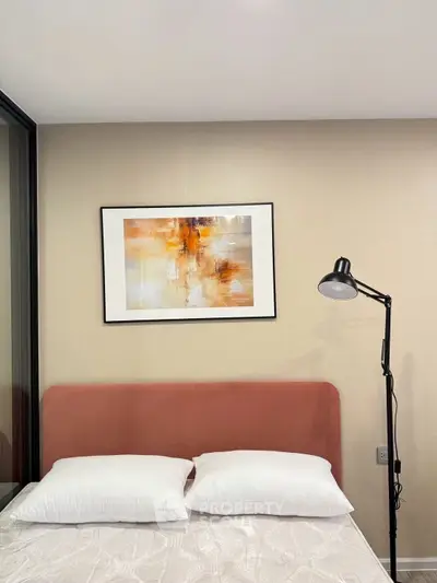 Modern bedroom with stylish decor and cozy lighting, perfect for relaxation.