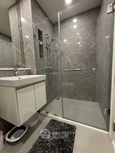 Modern bathroom with sleek glass shower and stylish vanity
