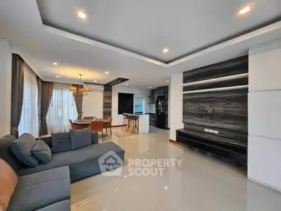 Spacious modern living room with open kitchen and elegant dining area