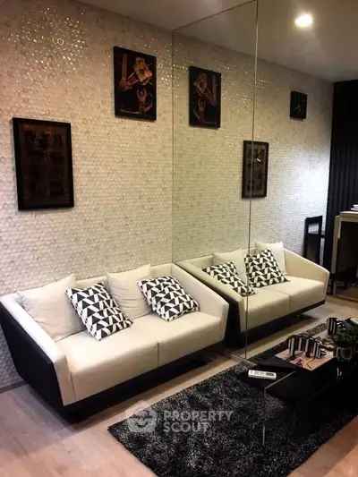 Stylish modern living room with chic decor and cozy seating area.