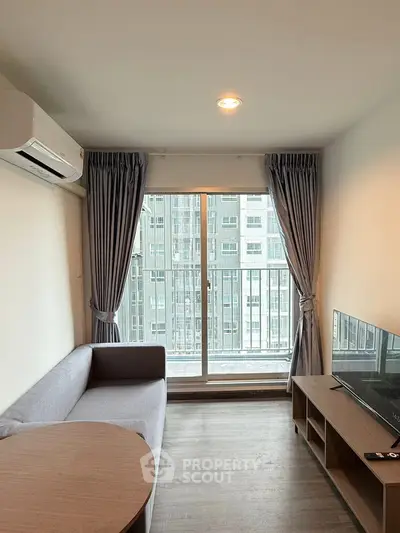 Modern living room with balcony view in high-rise apartment