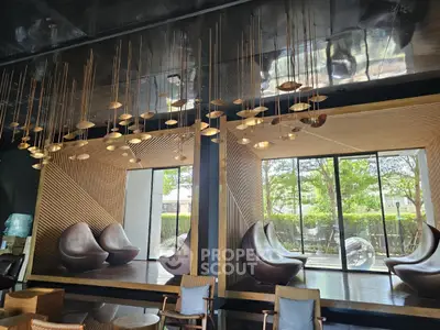Luxurious modern living room with unique hanging lights and stylish seating