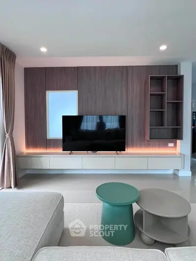 Modern living room with sleek TV unit and stylish furniture