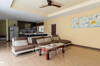 Spacious living room with modern open kitchen and stylish decor