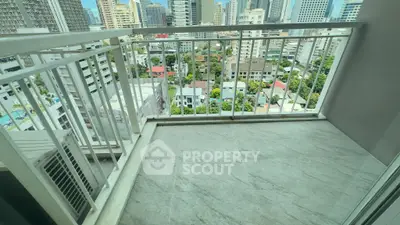 Spacious balcony with city view in modern high-rise apartment