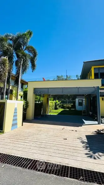 Modern home exterior with spacious driveway and lush garden