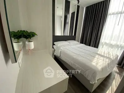 Modern bedroom with stylish decor and natural light