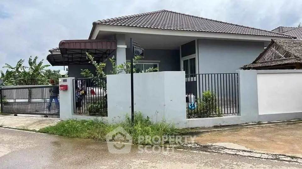 Charming single-story house with modern design and spacious yard in a serene neighborhood.