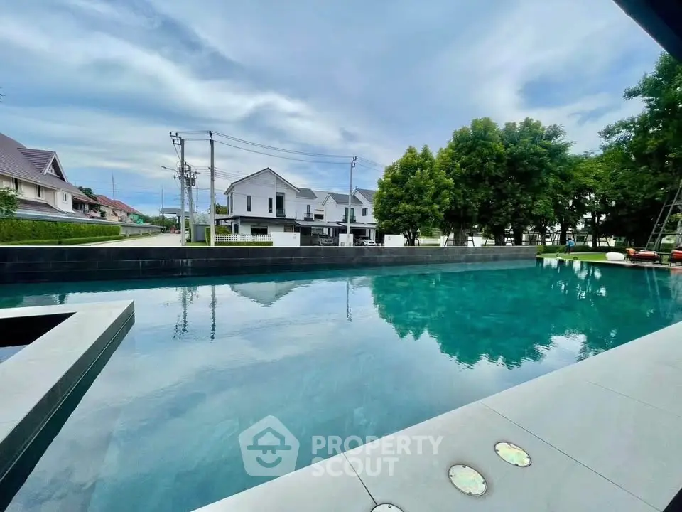 Luxurious residential pool with serene surroundings and modern architecture.