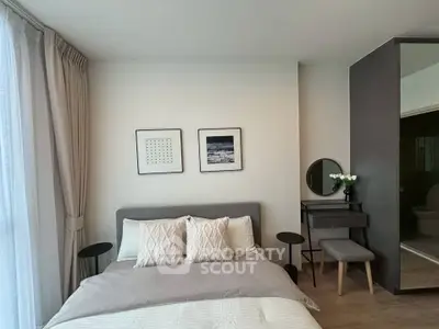 Modern bedroom with stylish decor and natural light