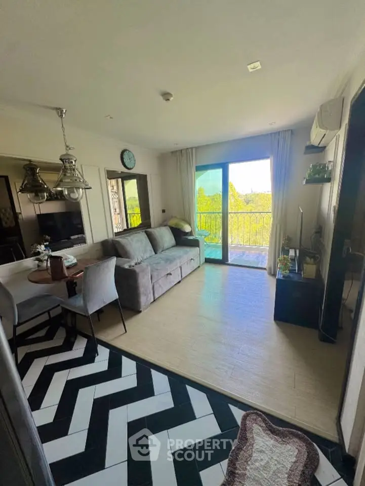 Charming living room with stylish decor and balcony view