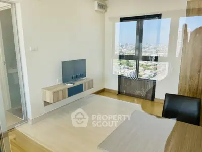 Modern living room with city view and sleek wooden flooring