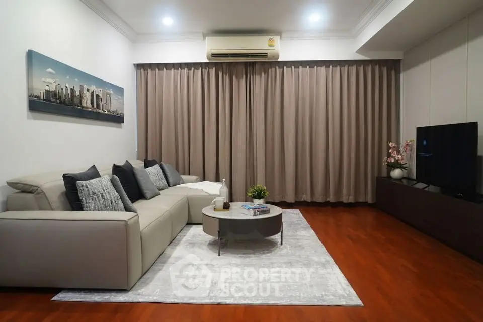 Elegant living room with modern sofa, stylish decor, and cozy ambiance.