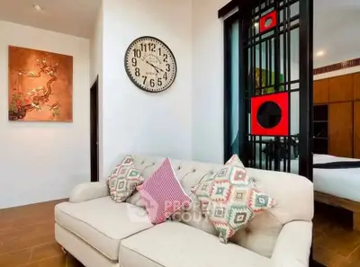 Stylish living room with modern decor and cozy sofa in a contemporary apartment.