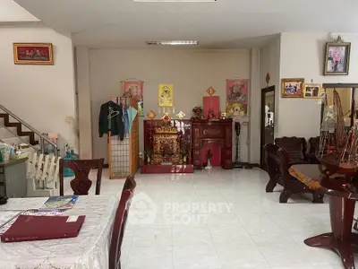 Spacious living room with traditional decor and elegant wooden furniture