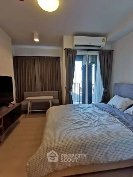 Modern bedroom with balcony access and stylish decor