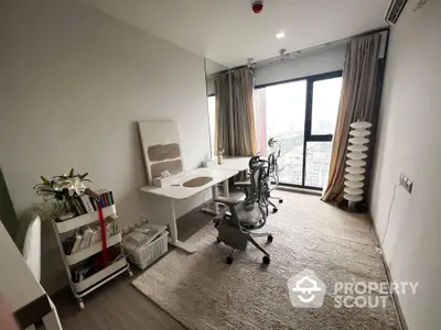 Modern study room with city view, featuring sleek desk and ergonomic chair.