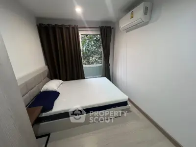 Cozy bedroom with modern air conditioning and natural light