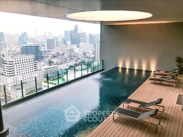 Luxurious rooftop pool with stunning city skyline view, perfect for relaxation and leisure in a modern urban setting.