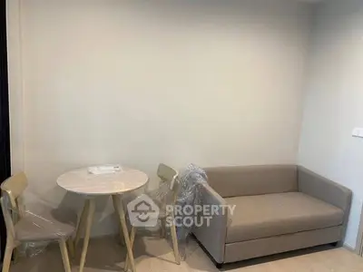 Cozy living room with modern sofa and dining set in minimalist style