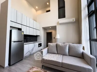 Modern loft apartment with high ceilings and sleek kitchen design