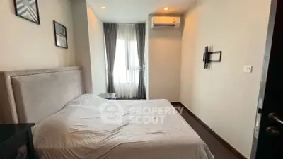 Cozy bedroom with modern air conditioning and natural light