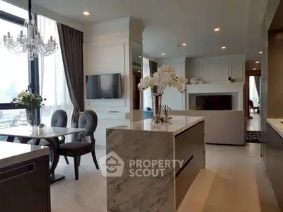 Luxurious open-plan living room with elegant dining area and modern kitchen island.