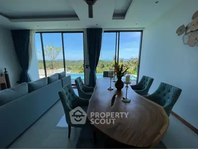 Luxurious living room with panoramic view and elegant dining setup