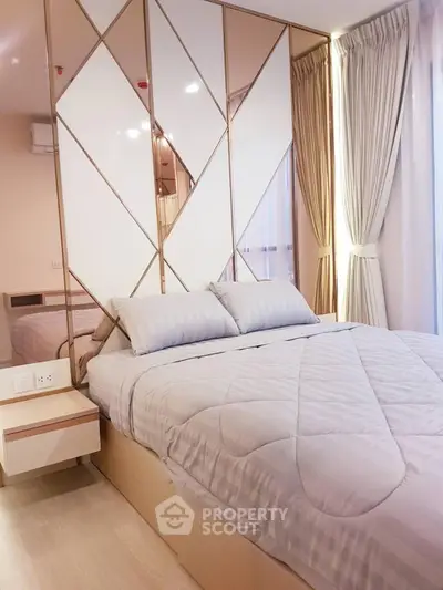 Luxurious bedroom with elegant decor and large windows for natural light