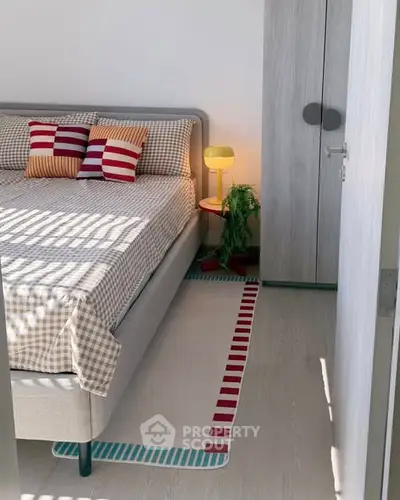 Cozy bedroom with stylish decor and modern furniture, perfect for relaxation and comfort.
