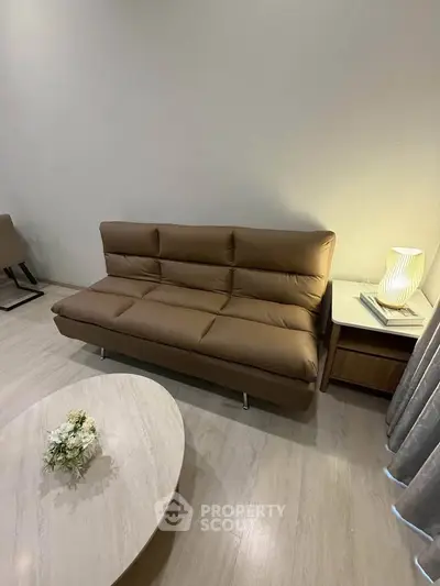 Modern living room with stylish brown sofa and elegant decor