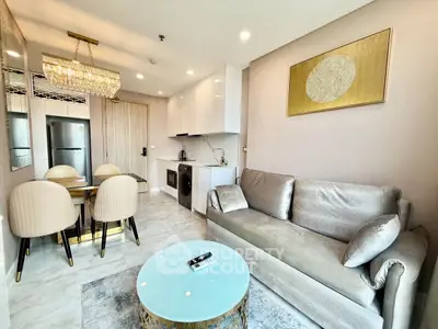 Luxurious modern living room with elegant decor and open kitchen layout