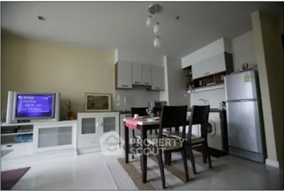 Modern kitchen and dining area with sleek appliances and stylish decor