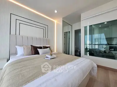 Luxurious modern bedroom with elegant decor and large windows offering natural light.