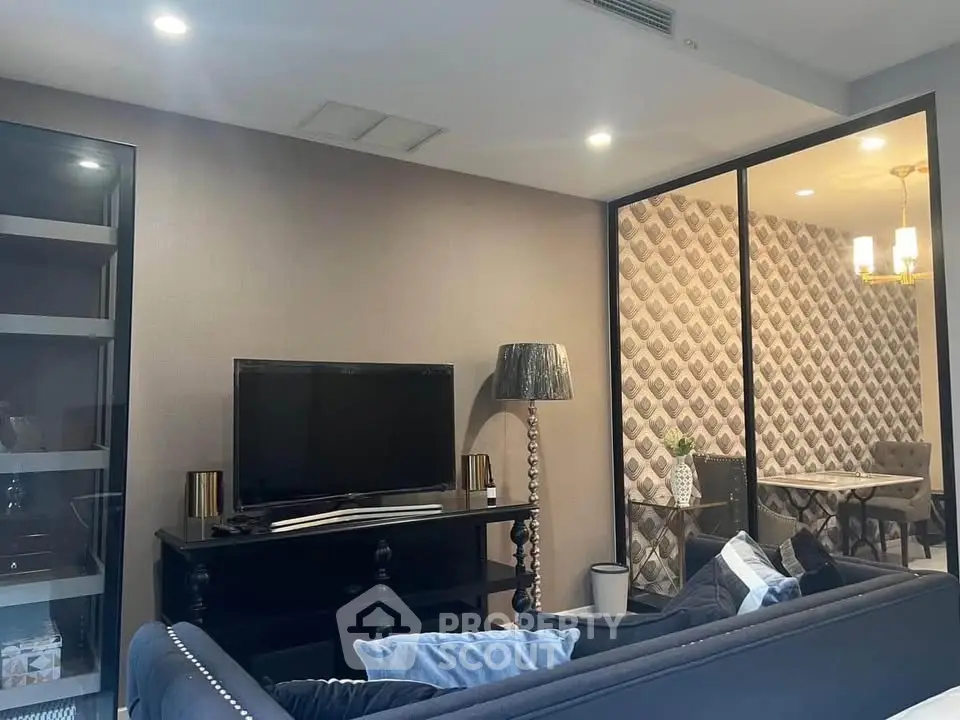 Modern living room with stylish decor and adjacent dining area